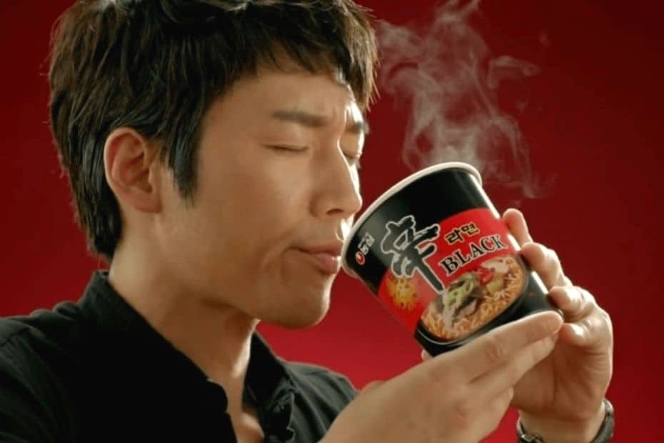Man enjoying a cup of best Korean ramen