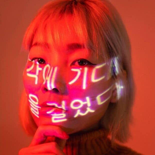 Korean woman with Korean language on her face
