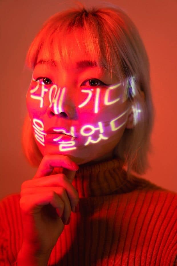 Korean woman with Korean language on her face