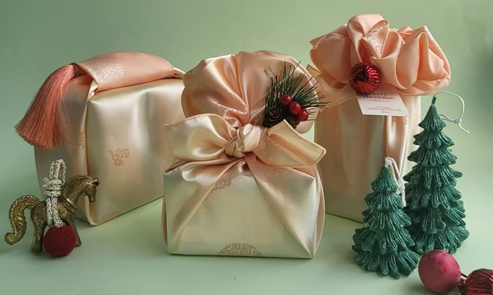 Three gift packages wrapped in the traditional Korean gift wrapping peach clothes.