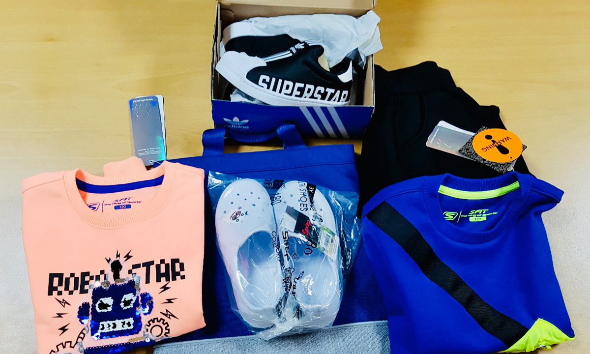 A donated gift of new shirts, shoes, and house slippers.