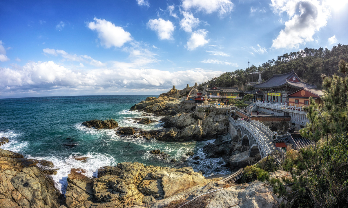A bright sunny day shines down on the seaside view of the Haedong Yonggungsa Temple near Busan.