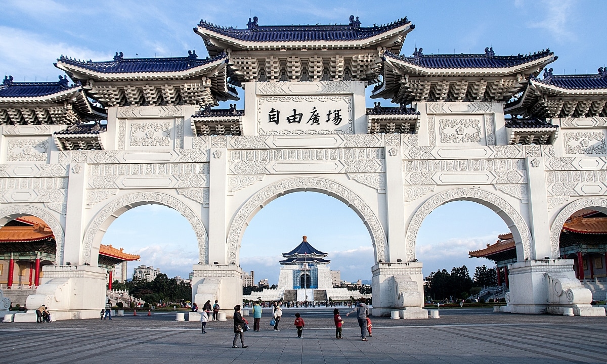 Massive white Chinese and intricately designed gates in front of Chiang Kai-shek Memorial Hall in Taipei, Taiwan.