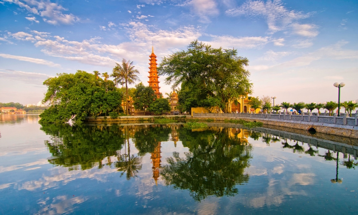 A mirrored reflection in the water beautifully captures the Tran Quoc Pagoda and its reflected doppleganger.