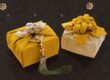 Beautifully wrapped gifts in traditional Korean cloth, featuring bold colors and tassel accents.