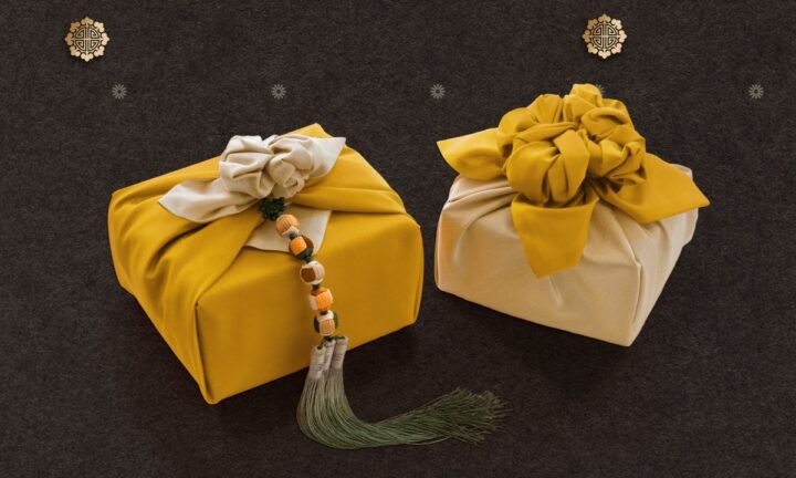 Beautifully wrapped gifts in traditional Korean cloth, featuring bold colors and tassel accents.