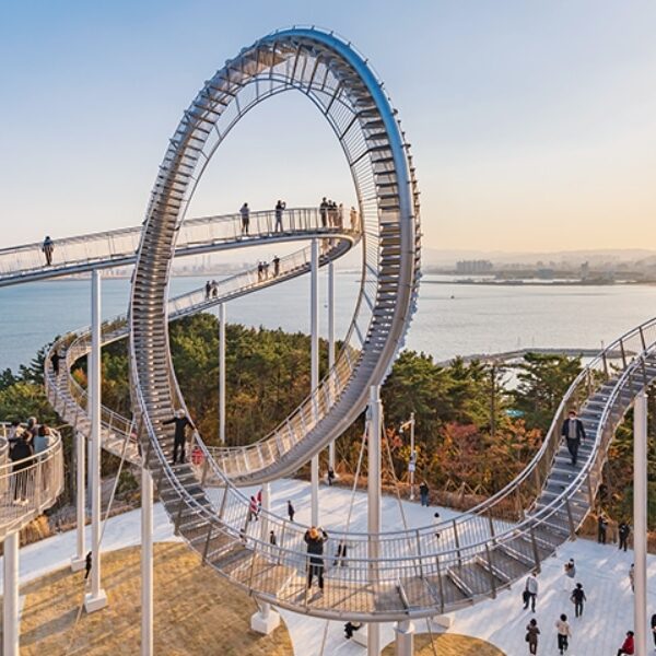 BOK_Pohang_Travel_Cover_2025 A beautiful side view of Pohang's Space Walk with a clear day and blue ocean behind it.