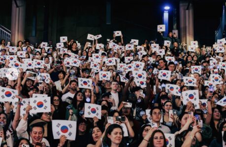 BTS Stanford fans holding up Korean flags.